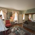 Bride looking out window of bridal suite