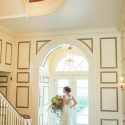 Bride in front of french doors at Drumore Estate