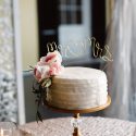 Wedding cake with gold lettering cake topper