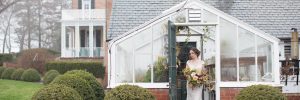 Bride in greenhouse during rainy day at Drumore Estate