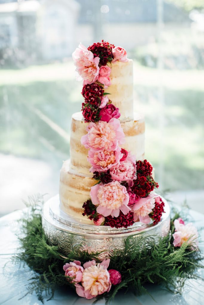 Semi naked e layer wedding cake with pink florals