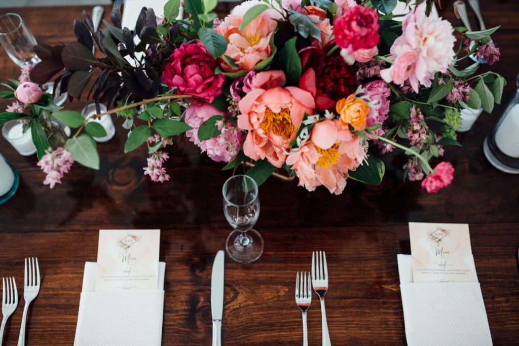 Farm table wedding reception at Drumore Estate, Lancaster PA with pink floral centerpiece