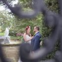 Bride and groom behind the cast iron gate at Drumore Estate