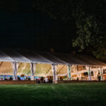 Grand Tent lit up at night at Drumore Estate