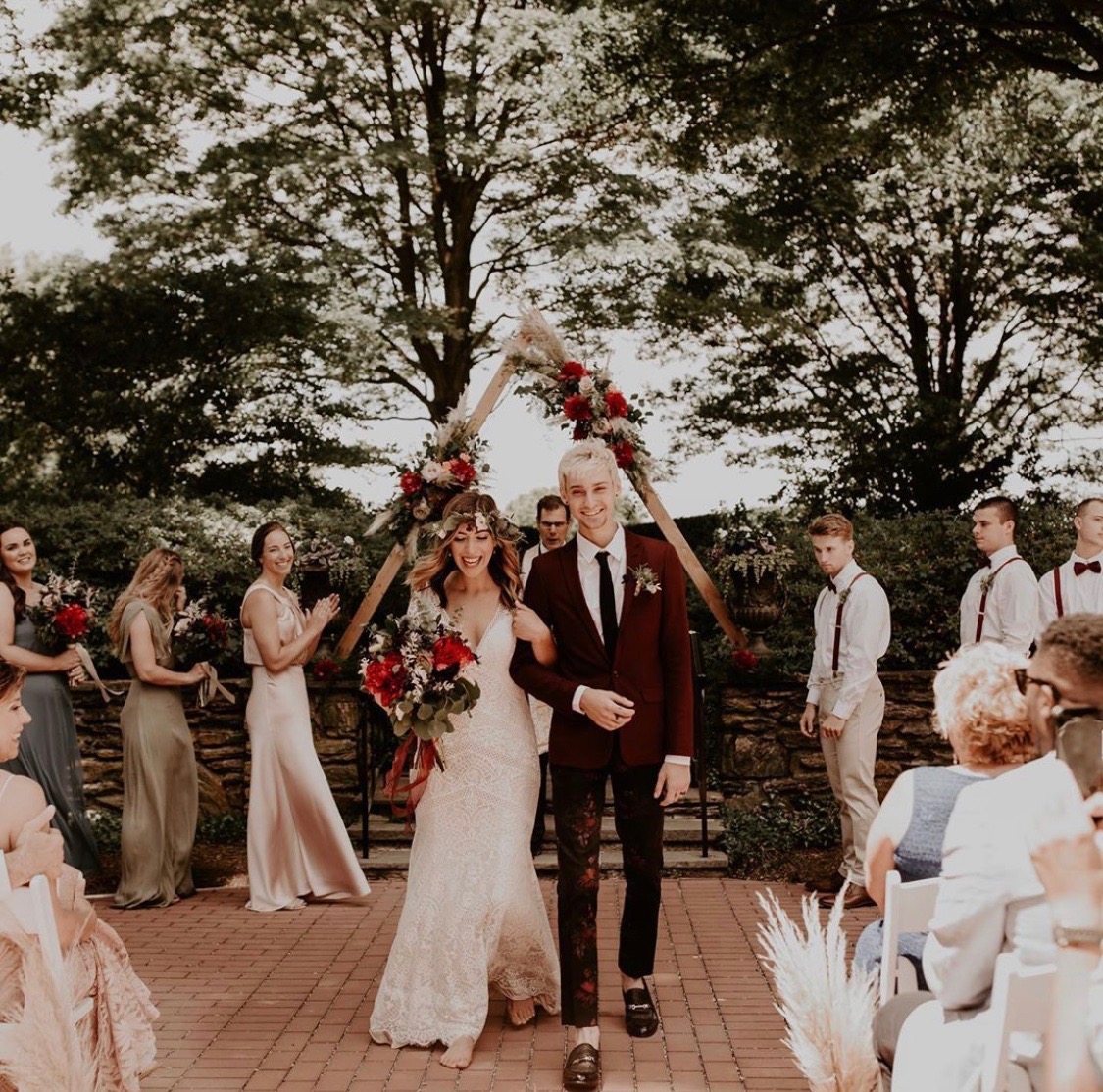 Mr. and Mrs, walking down the isle after wedding