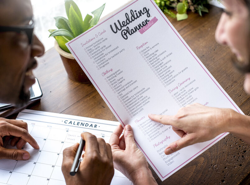 woman planning her wedding with a professional wedding planner