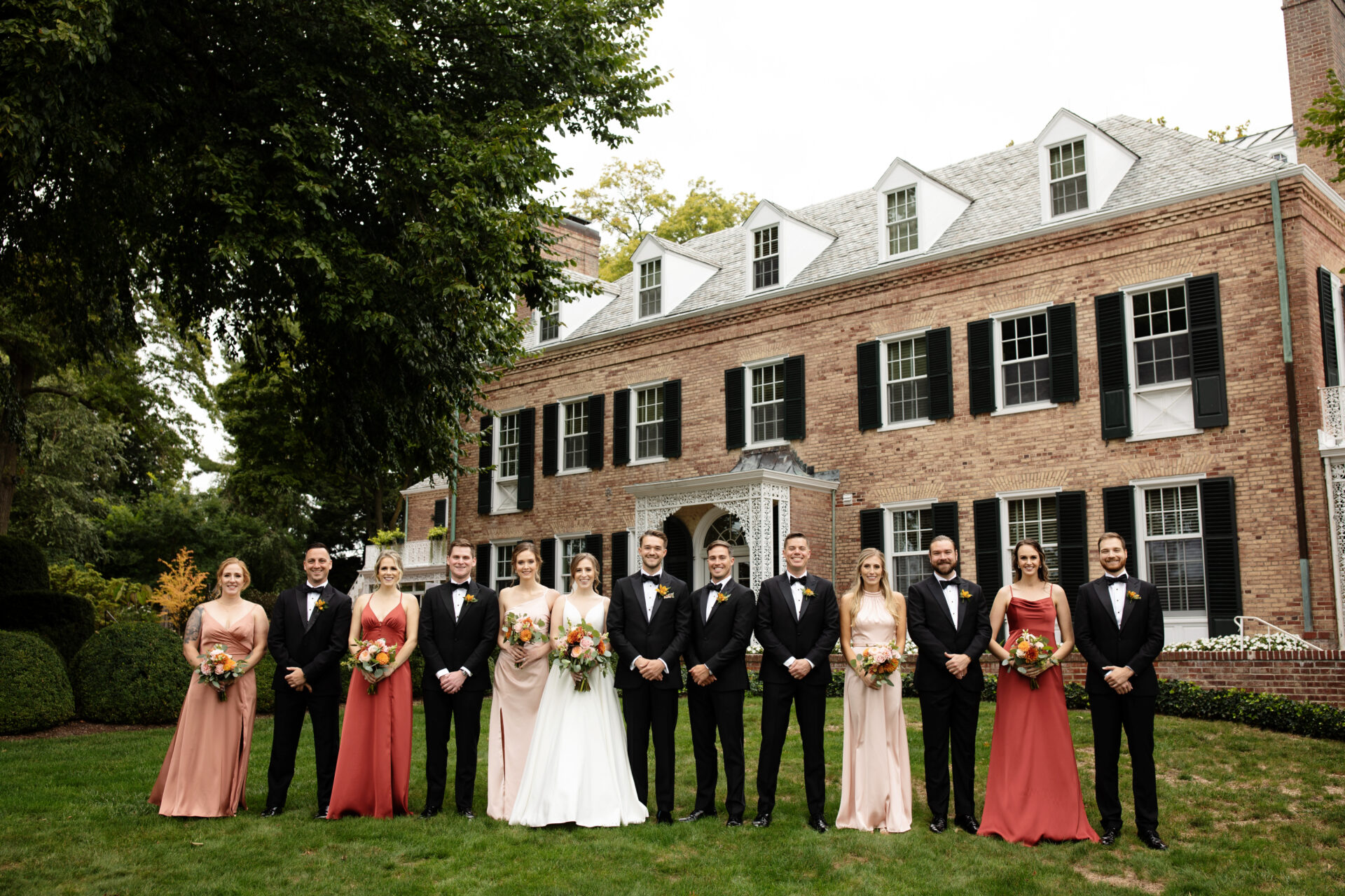 wedding party with bridesmaids in mismatched dresses