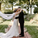 bride and groom embracing in Drumore Estate garden