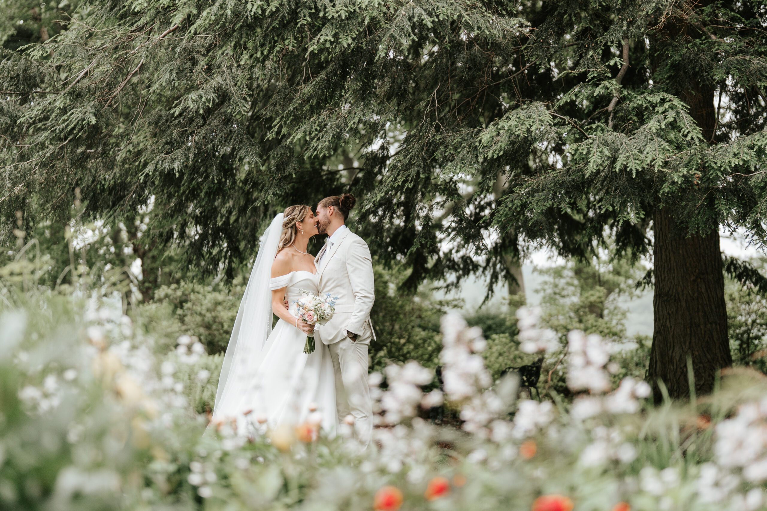 Bride and Groom kissing on the pathway on the grounds of Drumore Estate in Lancaster, PA